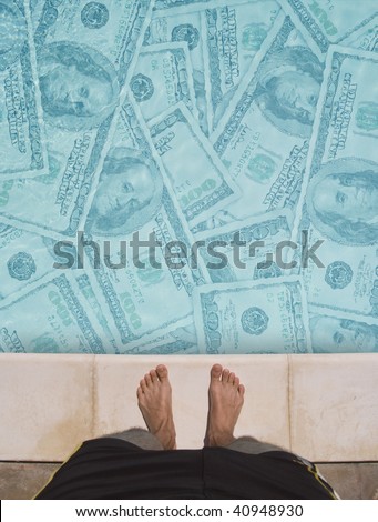 standing at the edge of a swimming pool full of money. about to jump in. jump for money.