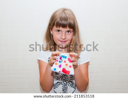 teen girl with colored candy purse searching something