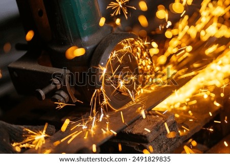 Image, Stock Photo Blacksmith cutting metal