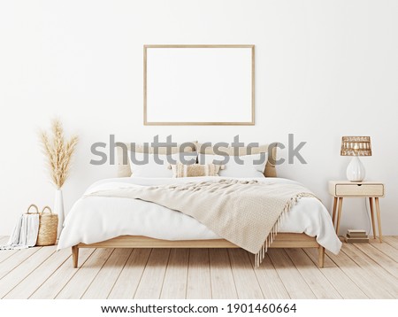 Horizontal frame mockup in boho bedroom interior with wooden bed, beige fringed blanket, cushion with tassels, dried pampas grass, basket and wicker lamp on white wall. 3d rendering, 3d illustration
