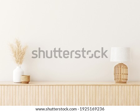 Interior wall mockup in minimalist Japandi style with light biege wooden console, dried pampas grass and wicker basket lamp on empty warm white background. Close up view, 3d rendering, 3d illustration