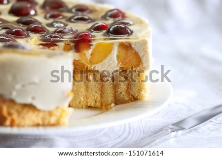 Cake with sweet cherries, peach and whipped sour cream.