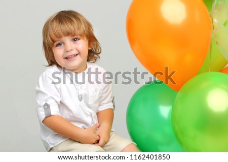 Similar – Image, Stock Photo 3-year-old birthday girl playing with her balloons on the couch