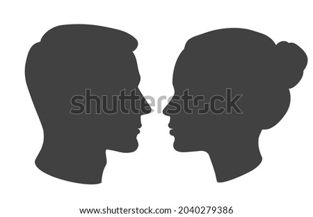 Vector silhouette of man and woman heads face to face in profile. Portrait of young beautiful girl, boy looking side. Close up isolated illustration on white. Stockfoto © 
