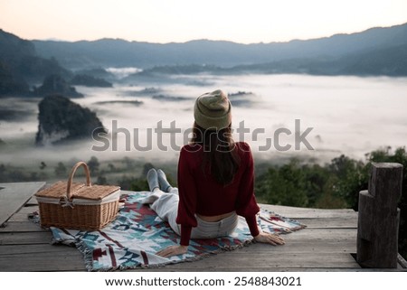 Similar – Image, Stock Photo Woman on the North Sea beach. Lots of sky, water and sand. Memories.