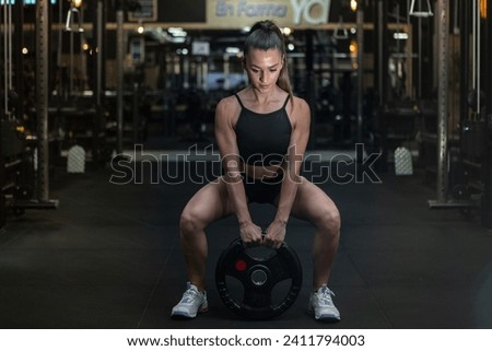 Similar – Image, Stock Photo Focused sportswoman doing squats with elastic band in apartment