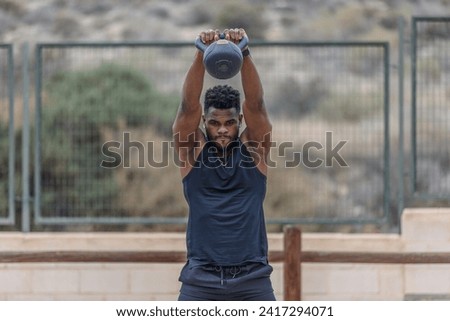 Similar – Image, Stock Photo Strong sportsman during intense training