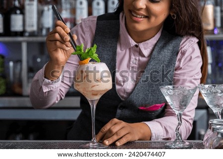 Similar – Image, Stock Photo Crop barman putting leaf on cocktail