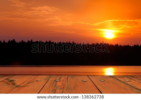 View of Sun Setting Behind Black Forest from Wooden Deck