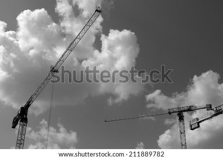 Crane and building construction construction site black and white photography