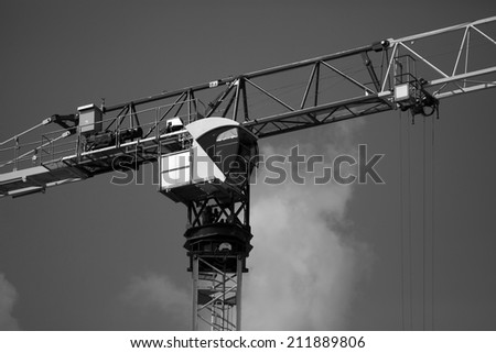 Crane and building construction construction site. black and white photography