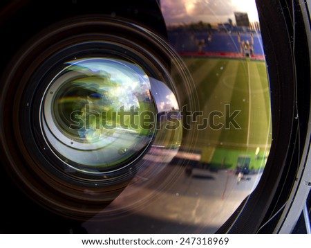 reflection and glare in the lens of the television camera.