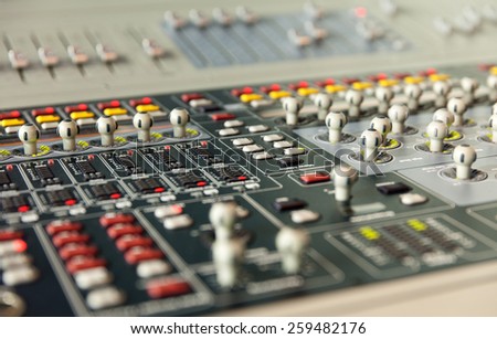 sound studio adjusting record equipment\
console sound engineer