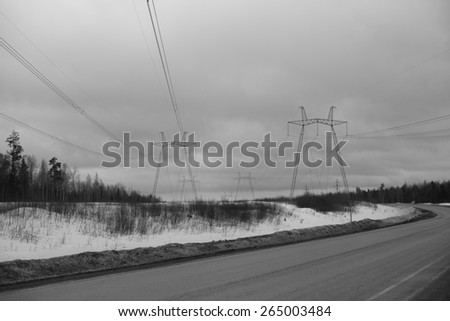 High-voltage transmission lines.
black and white photo