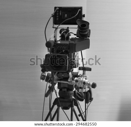 tv camera in a concert hal. Professional digital video camera. black and white photo