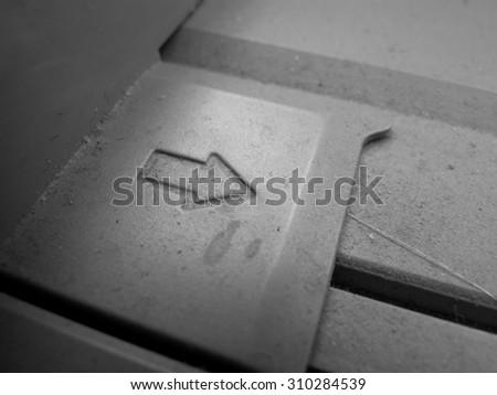 Closeup of printer toner cartridge.\
black and white photo