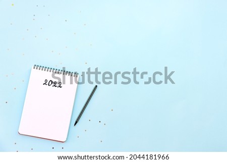 Similar – Image, Stock Photo blue notebook and scattered wooden multi-colored letters on an abstract background