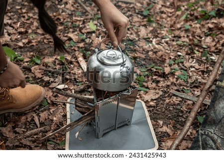 Similar – Image, Stock Photo Kettle placed on campfires in snowy woods at sundown