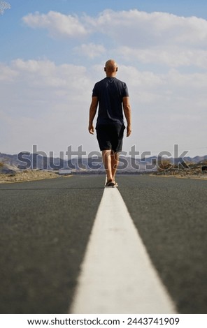 Similar – Image, Stock Photo Anonymous traveling man walking along wooden footbridge