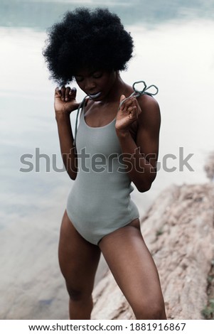 Similar – Image, Stock Photo Ethnic model in bodysuit on black background