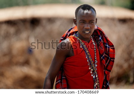 MASAI MARA - OCTOBER 02 : Young male posing in masai village on October 02 , 2013 in Masai Mara,Kenya