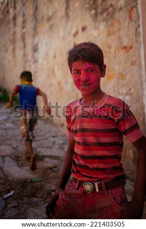 JAIPUR-MARCH 04 :child preparing for religious celebration in the street on March 04, 2014 in Jaipur,india