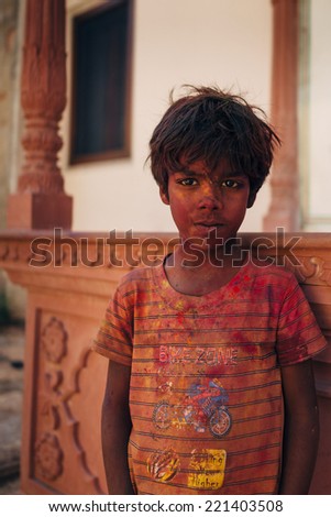 JAIPUR-MARCH 04 :child preparing for religious celebration in the street on March 04, 2014 in Jaipur,india