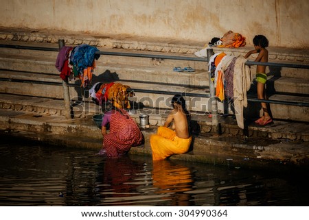 UDAIPUR - MARCH 25 : women washing in the street on March 25 , 2014 in Udaipur,India