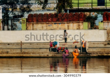 UDAIPUR - MARCH 25 : women washing in the street on March 25 , 2014 in Udaipur,India
