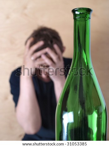 Color photo of the bottle and man. Problems with alcohol.