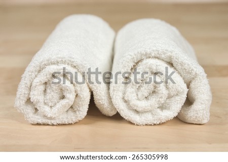 Two clean fresh towels rolled up