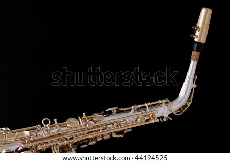 A professional silver and gold alto saxophone music instrument isolated against a black background.