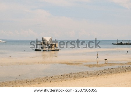 Similar – Image, Stock Photo small boats parked on the sand of a beach during sunset