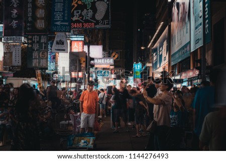 July 28, 2018, Hong Kong: Mong Kok Street Culture. People watching a street musician performance at Sai Yeung Choi Street, Mongkok in Hong Kong