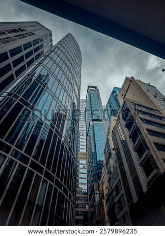 Similar – Image, Stock Photo Gloomy skyscraper facade with graphically cut hedge plant