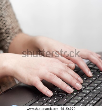 computer operator with hand on keyboard