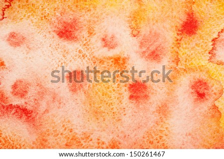 Texture from  red and orange watercolor stains on white paper