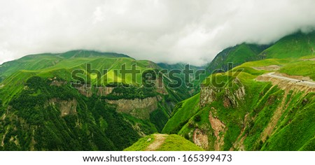 Green caucasus  mountains panoramic cloudy landscape in Georgia, natural background