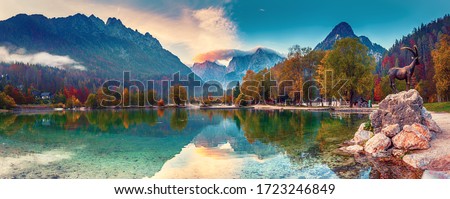 Photo of Jasna lake with beautiful reflections of the mountains. Triglav National Park, Slovenia