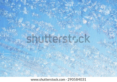 Winter iced blue pattern with snowflakes, holiday seasonal background