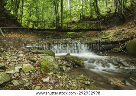 Mountain fast flowing river Shipot waterfall stream of water in the rocks