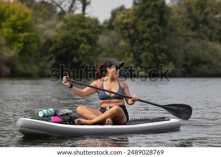 Similar – Image, Stock Photo Sportswoman looking lake from pier