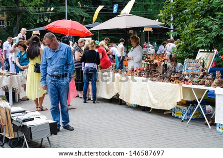 KALININGRAD, RUSSIA - JULY 14: Street trade in goods of folk art at celebration day of the city on july 14, 2013 in Kaliningrad, Russia.