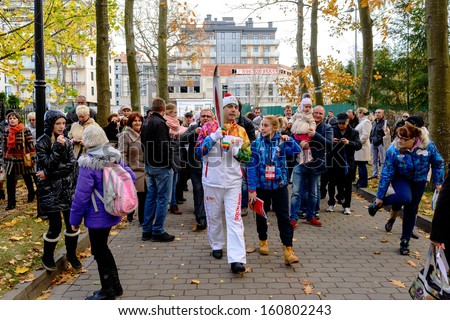 SVETLOGORSK, RUSSIA - OCTOBER 29: Olympic torch bearer participates in relay of Olympic Flame on October 29, 2013 in Svetlogorsk, Russia.