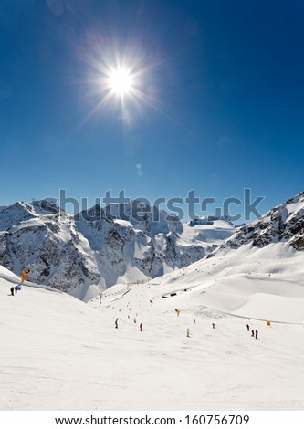 Snowy winter landscape and sunshine in the alps