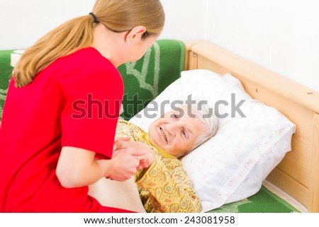 Young carer giving helping hands for the elderly woman