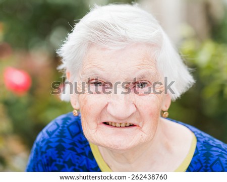 Portrait of elderly woman smiling at the camera