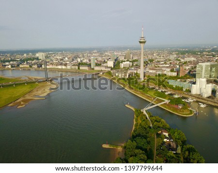 Similar – Image, Stock Photo aerial view of dusseldorf at sunset with the Rheinknie Bridge