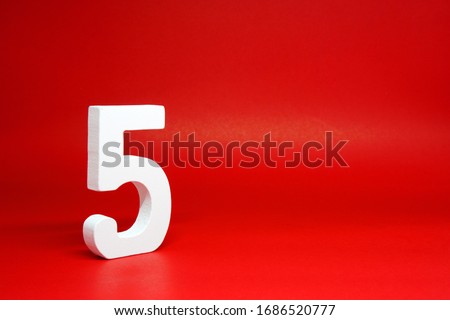 Five ( 5 ) white number wooden Isolated Red Background with Copy Space - New promotion 5% Percentage  Business finance Concept  商業照片 © 