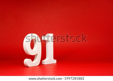 Ninety One ( 91 ) white number wooden Isolated Red Background with Copy Space - New promotion 91% Percentage   Business finance or birthday Concept - advertise banner picture online with copy space